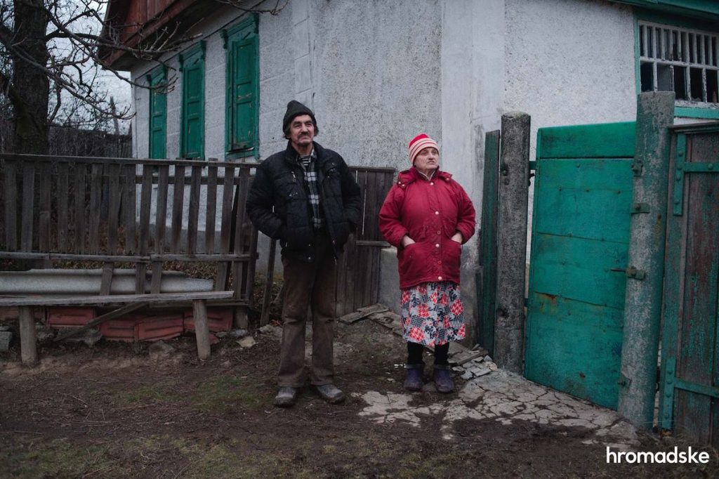 Vladimir Alekseevich and Anna Filippovna show the front-line village of Novoaleksandrovk in eastern Ukraine, in which only ten residents remain
Photo: Max Levin / hromadske