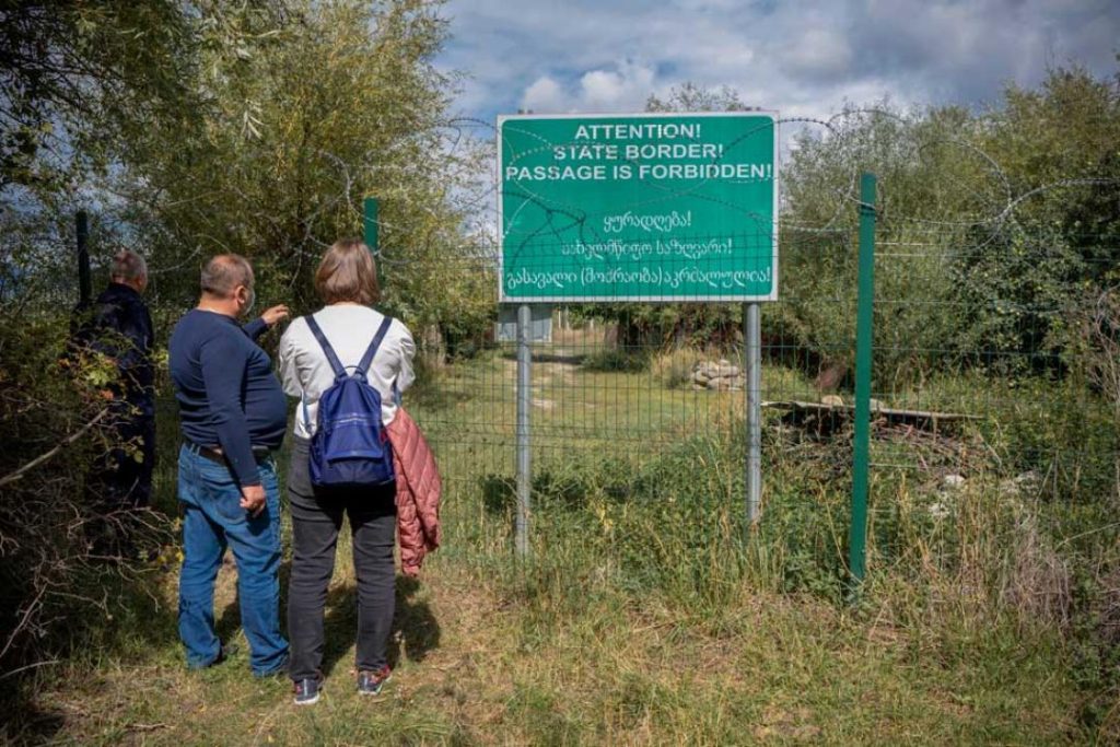 On the Georgian side of the line, signs are in English and Georgian. On the other side, they are in Russian and Ossetian. CRISIS GROUP/ Michelle Malaney