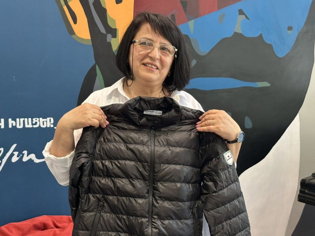 Ruzanna Sahakyan shows which jackets their shop makes. Photo JAMnews