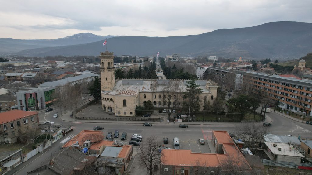 The city of Gori against the backdrop of the Stalin Museum building. February, 2024. Photo: David Pipia/JAMnews