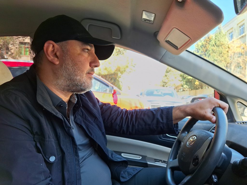 Farid Asadov, 46, is a lawyer by profession, but has been working as a taxi driver for three years. Photo: Fatima Movlamly/JAMnews "Why leave people without jobs?" - Azerbaijani taxi drivers unhappy with new regulations