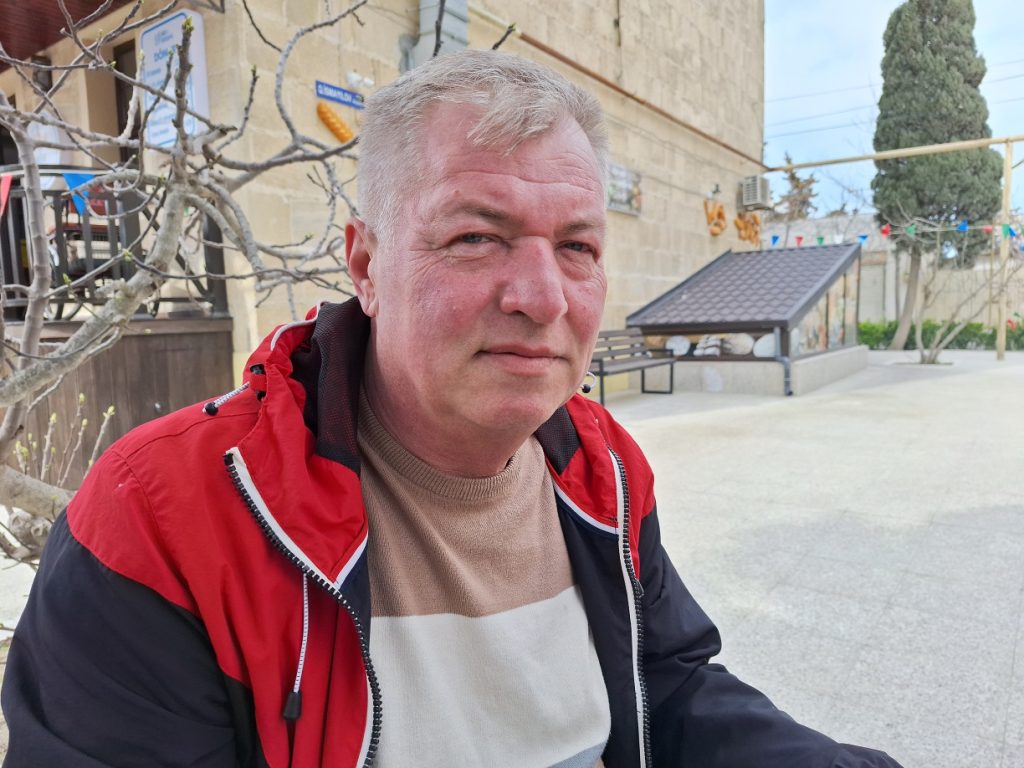 Grigory Kochnev was one of the first to order a gravestone with a QR code for his grandfather. Photo: Fatima Movlamli/JAMnews Graves with QR Codes in Azerbaijan