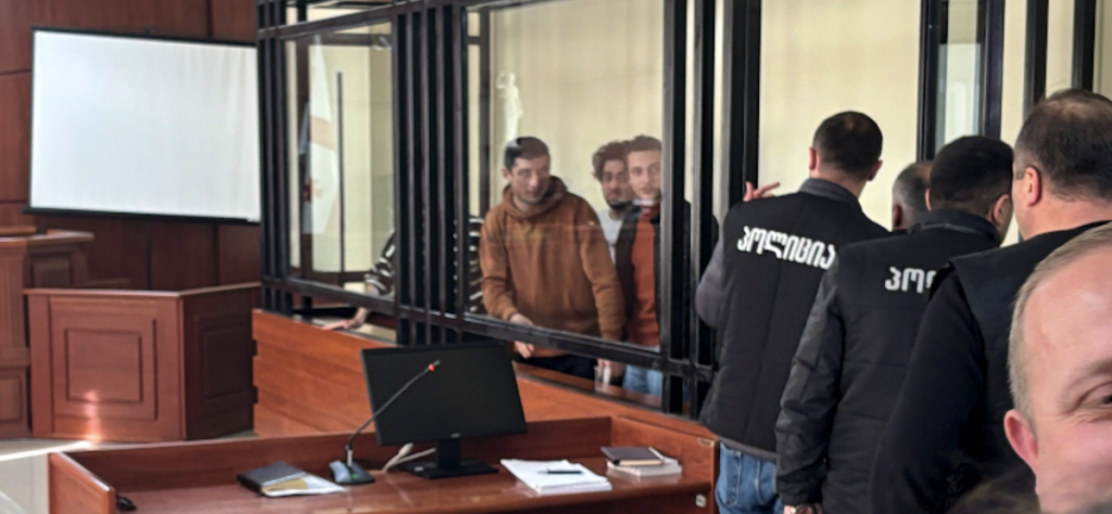 Professor Mamuka Jorbenadze and his students—22-year-old Giorgi Davitadze, 20-year-old Andro Kakabadze, 21-year-old David Gianidze, and 20-year-old Guram Mikeladze—during their court hearing on December 11. Photo courtesy of Batumelebi. Arrest of professor and four students in Batumi